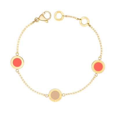 Gold-plated chain bracelet with three coral and nude enamel circle charms by Jason Hyde