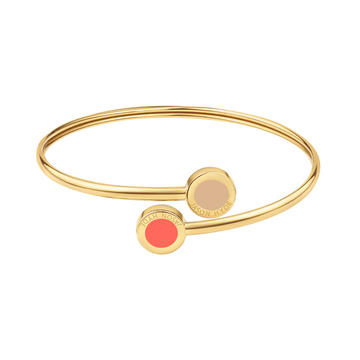 Gold open bangle bracelet with beige and coral enamel charm and minimalist design.