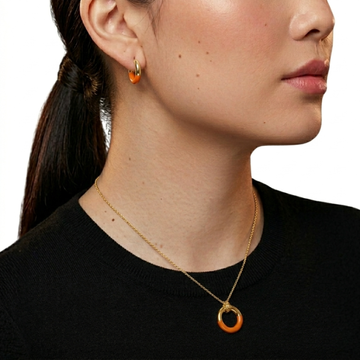 Jason Hyde gold jewelry set: matching necklace and hoop earrings with orange recycled plastic circles.