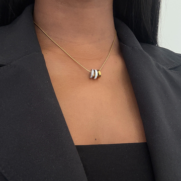 Minimalist gold chain necklace for women featuring three distinct ring charms