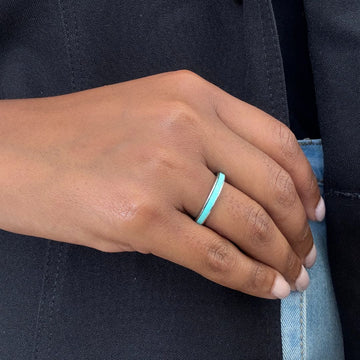Modern silver-tone band ring with a smooth turquoise enamel finish