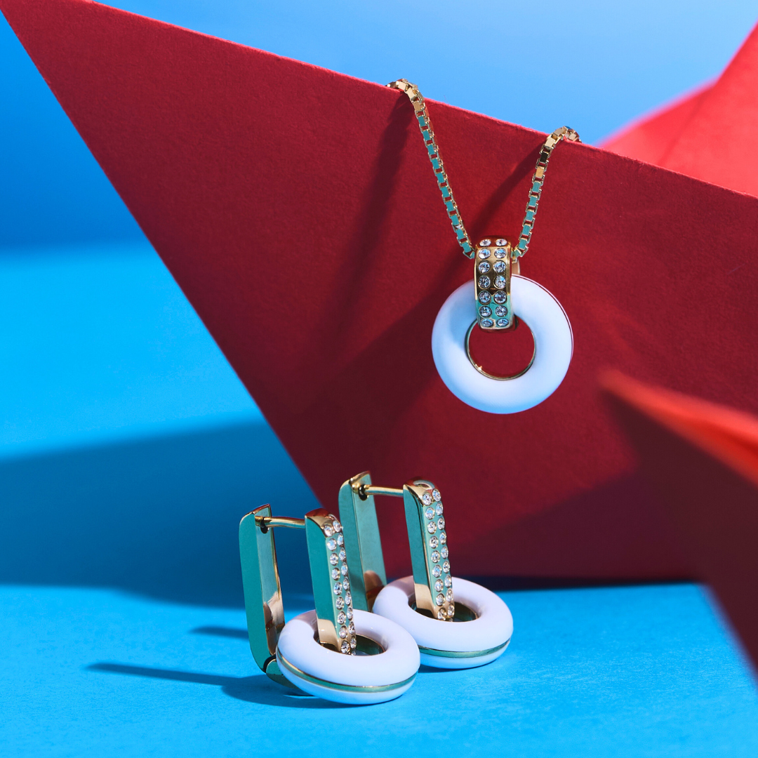 Jason Hyde Lifesaver necklace and earrings with white circular pendants 