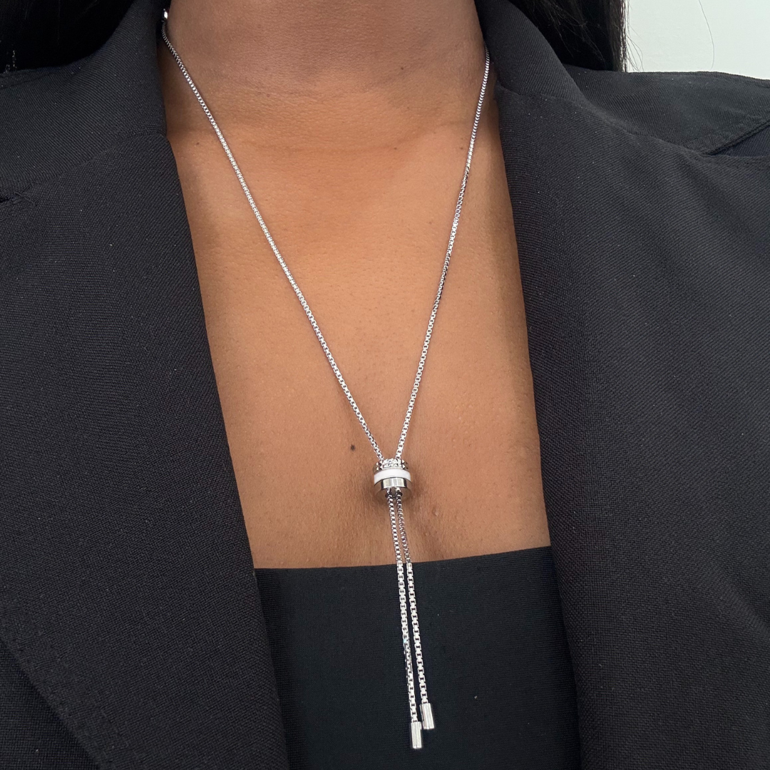 Silver lariat necklace with white enamel and crystal pendant