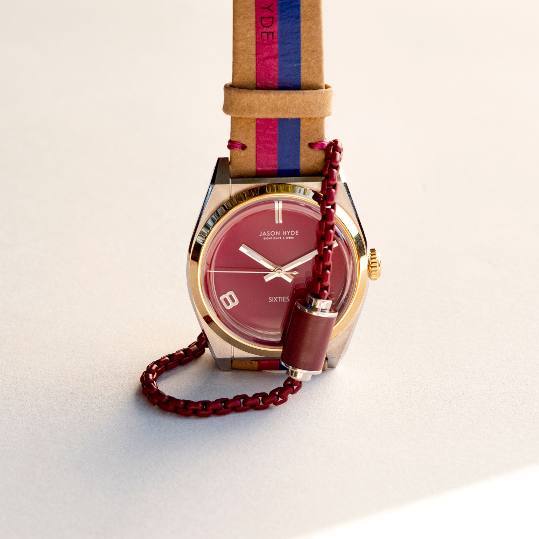 Jason Hyde 34mm watch with red dial, striped strap, and red chain accessory
