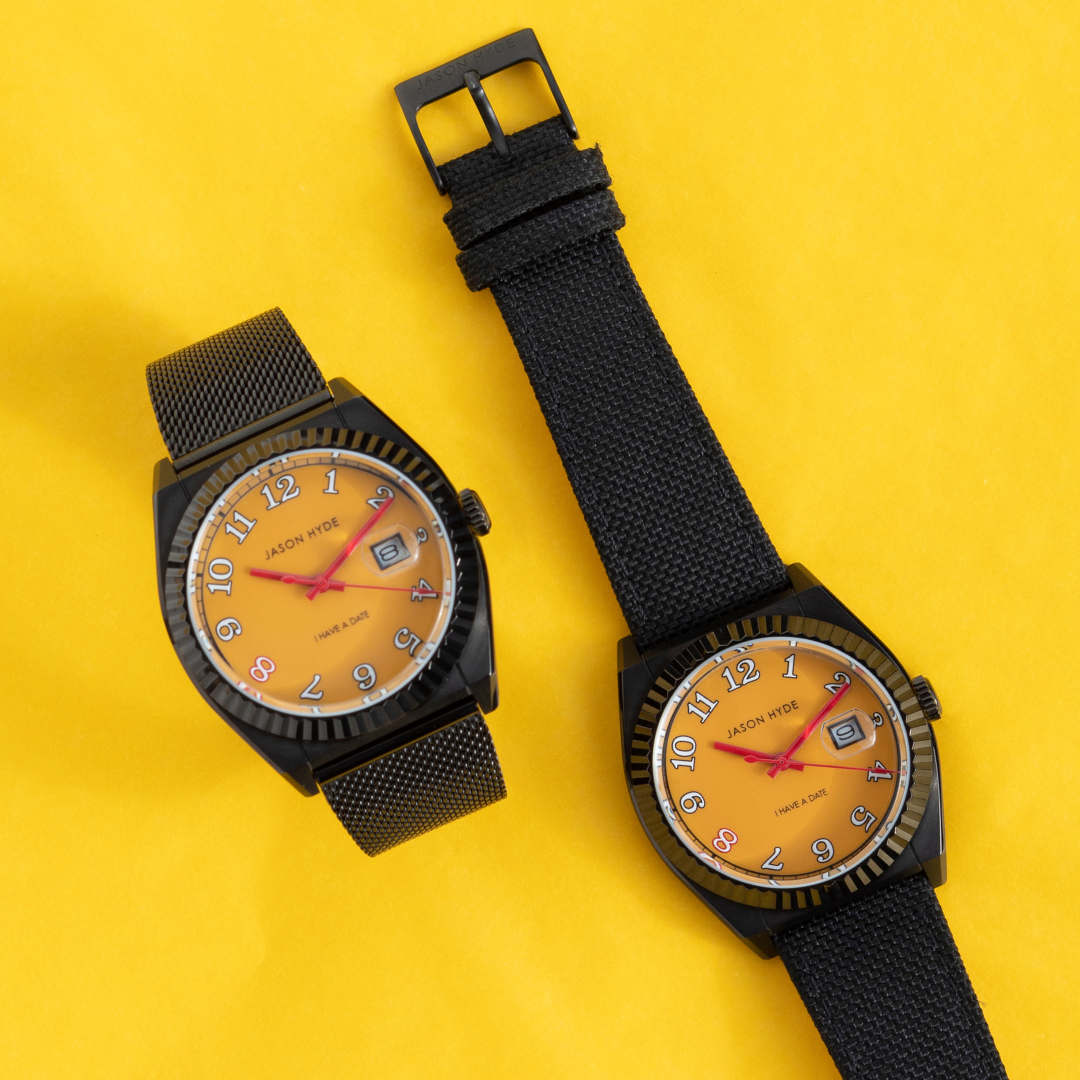 Two jason hyde 'i have a date' 40mm watches, yellow dials: one with mesh, one with black strap.