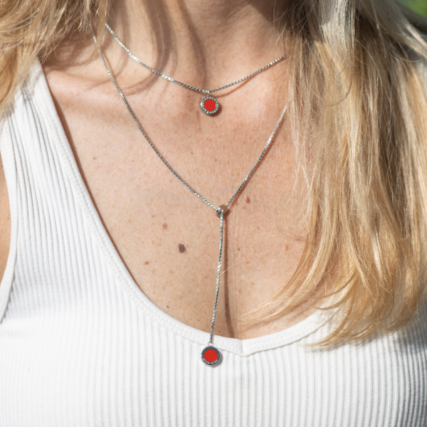 Jason Hyde elegant silver necklaces, one lariat, with striking red charms.