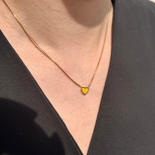 Jason Hyde minimalist spectra yellow heart pendant.