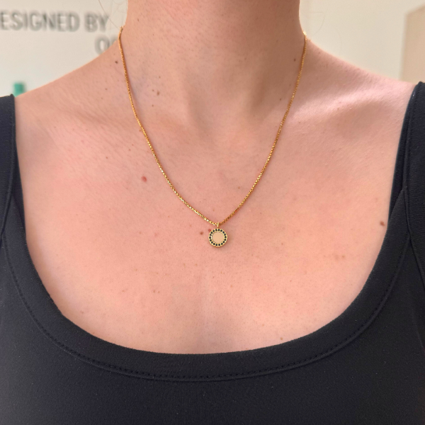 Gold Jason Hyde necklace featuring a beige chip and black zirconia