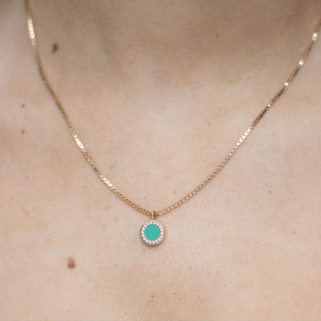 Sustainable Jason Hyde necklace with turquoise chip charm framed by zirconia 