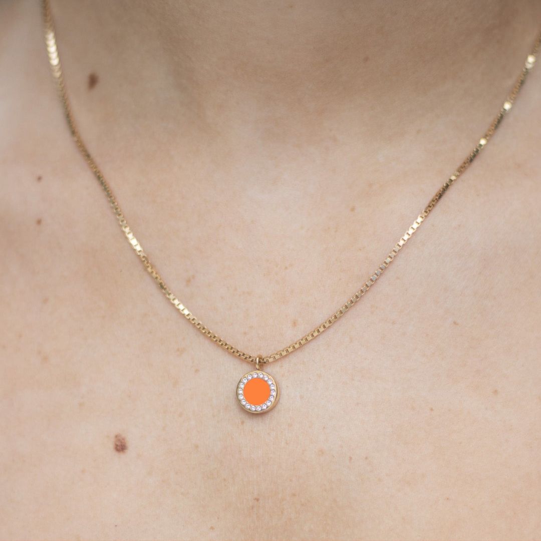 Modern Jason Hyde sustainable necklace with orange chip and sparkling zirconia 
