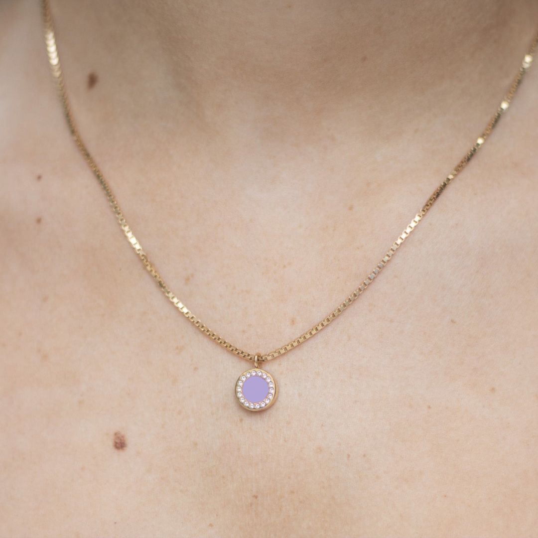 Eco-friendly gold necklace with lavender chip pendant bordered by zirconia 