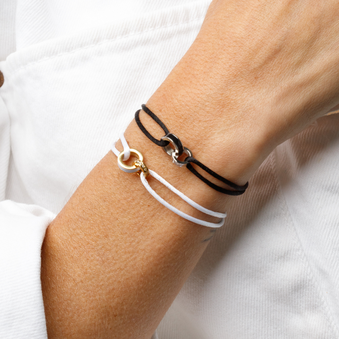 Eco-friendly black and white cord bracelets set with metal details by Jason Hyde