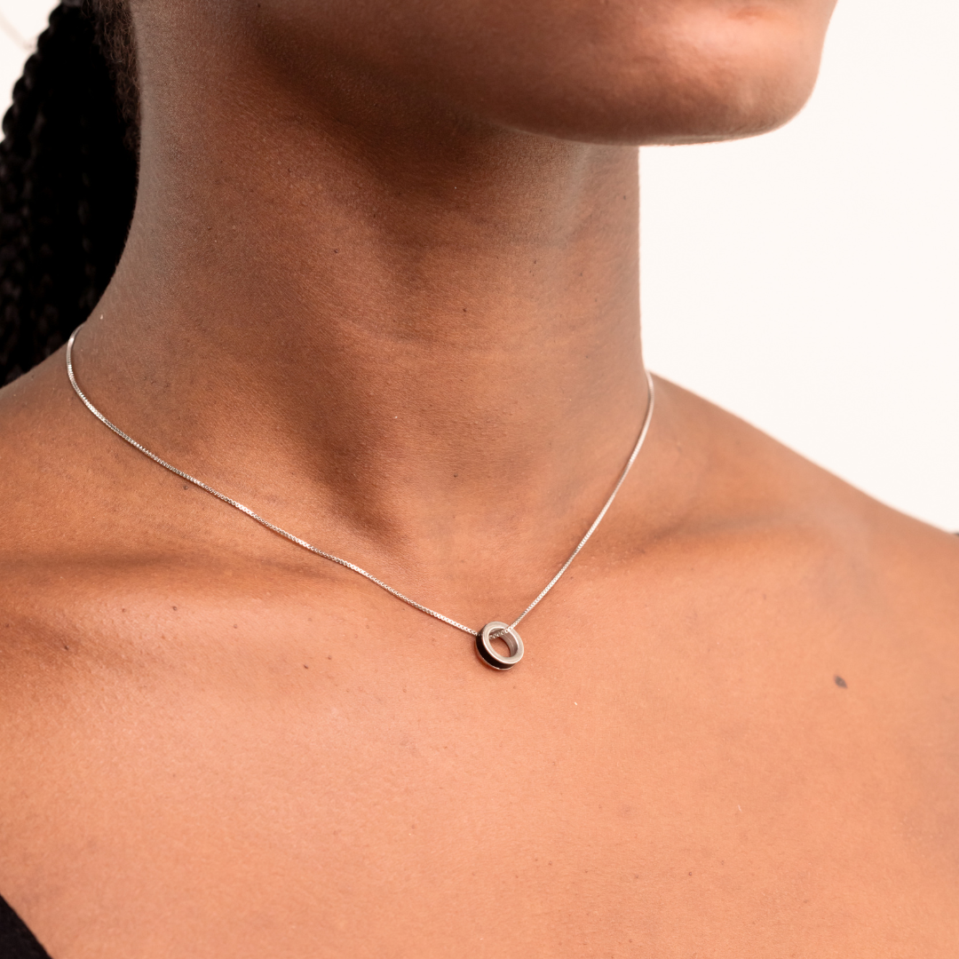Sustainable sterling silver necklace with modern round pendant by Jason Hyde