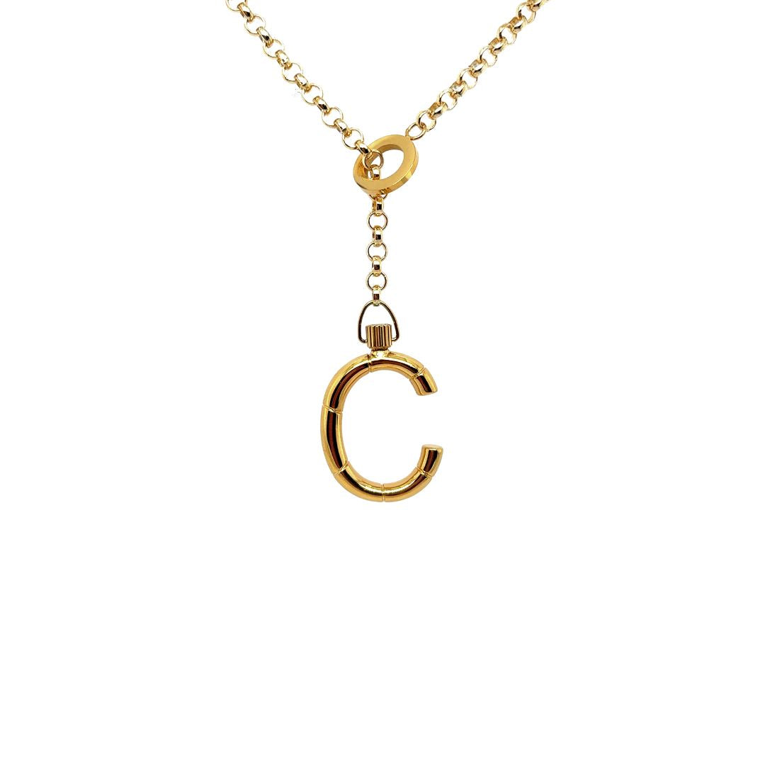 Gold jewelry: 'c' letter pendant on a delicate chain.