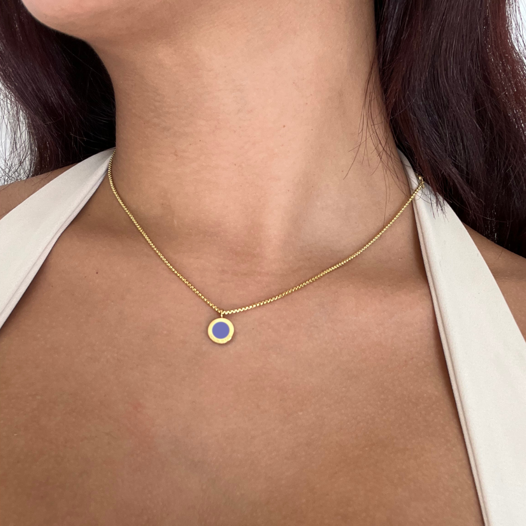 Gold pendant necklace with persian blue enamel circle by Jason Hyde