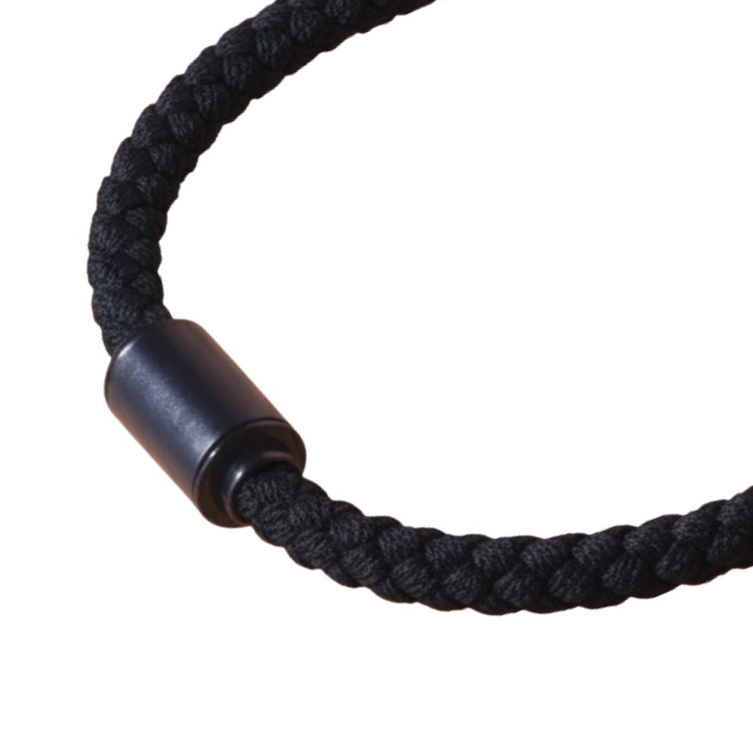Jason Hyde black braided cord bracelet on a white background.
