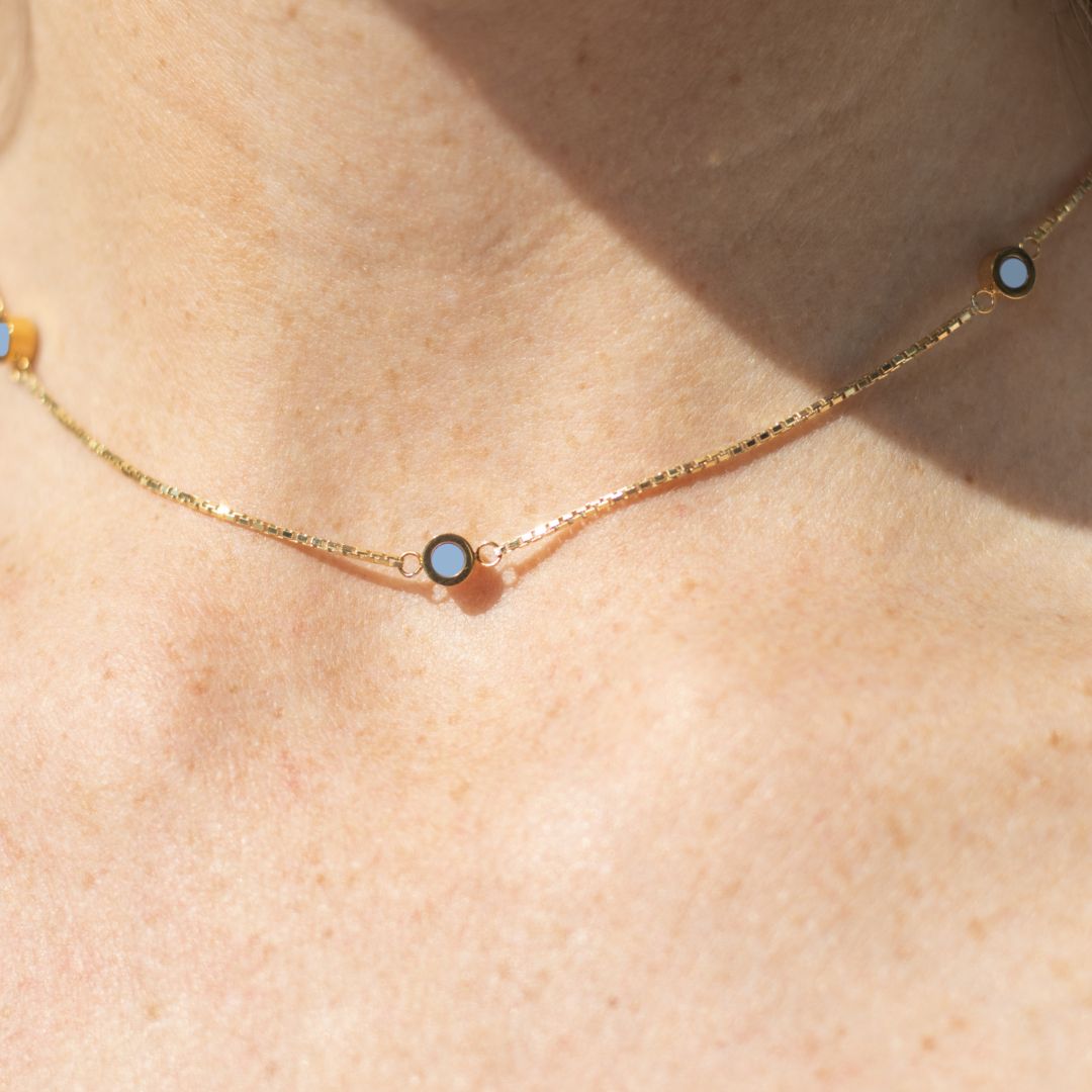 Delicate gold necklace with powder blue chips