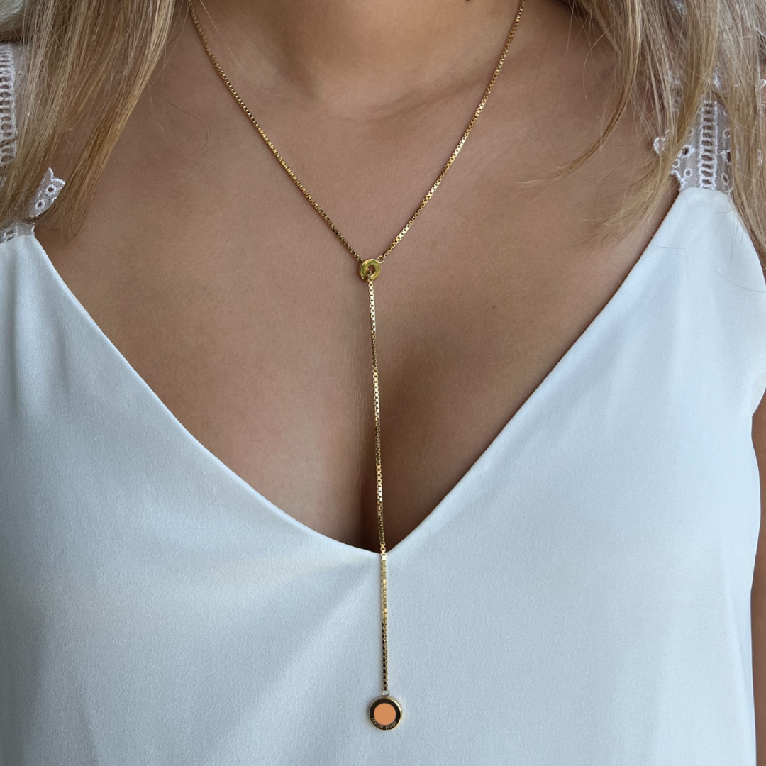 Gold lariat necklace with apricot crush recycled ocean plastic pendant by Jason Hyde