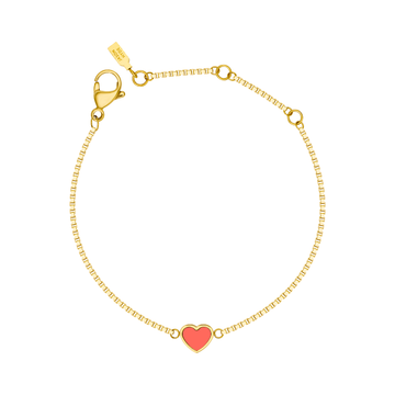 A delicate gold-tone chain bracelet by Jason Hyde featuring a single, small coral-colored enamel heart charm