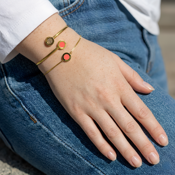 Jason Hyde Coral Chips Bracelets on a woman's wrist