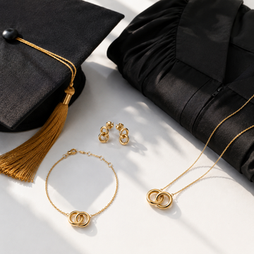 Jason Hyde gold necklace, bracelet and earrings styled with graduation cap 