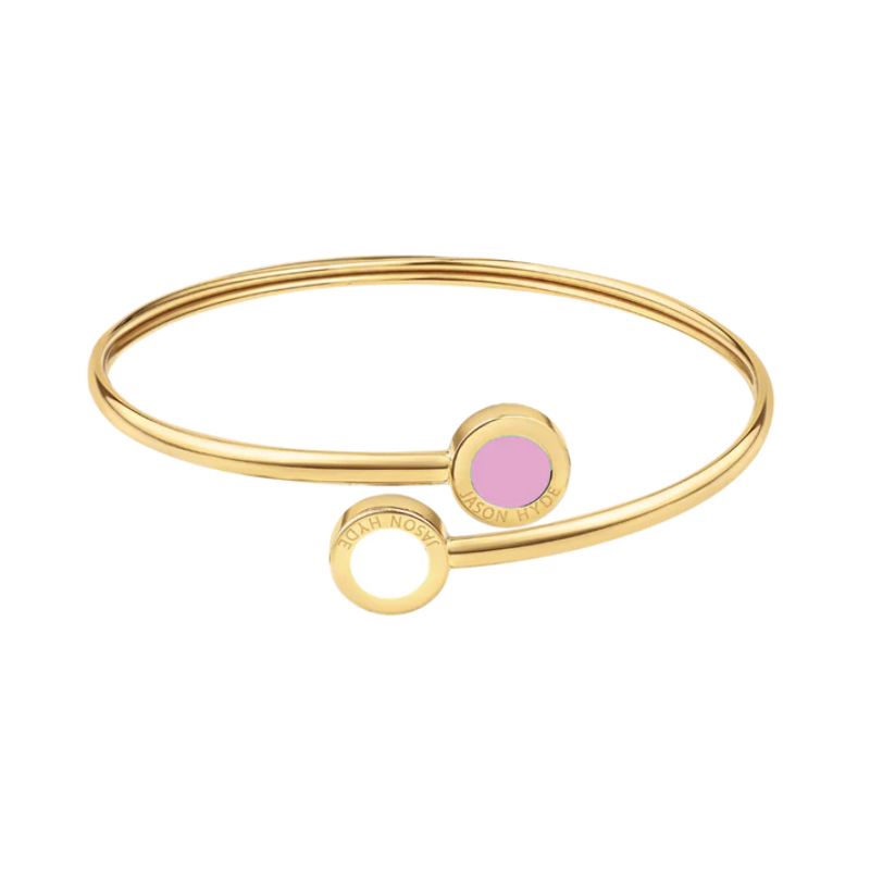 Jason Hyde gold open bangle bracelet with pink enamel charm and minimalist design.