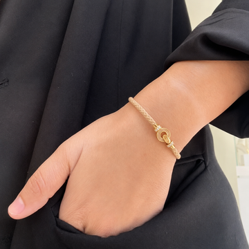 Model wearing a Jason Hyde beige braided cord bracelet