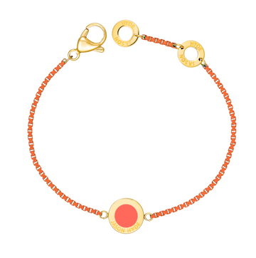 An image showing a Jason Hyde cord bracelet made of textured coral material with gold-tone accents.