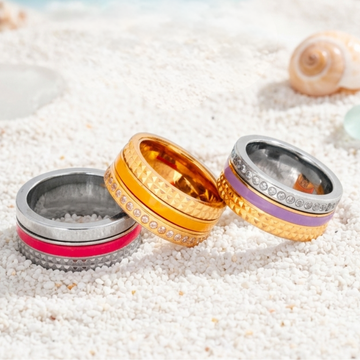 Three colorful, multi-layered sustainable rings from the Jason Hyde jewelry