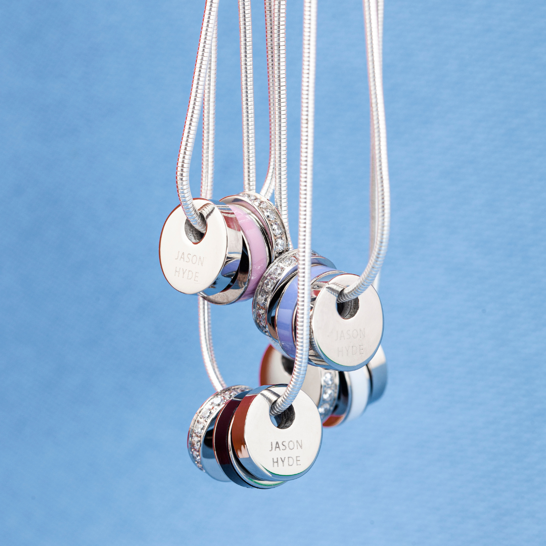 Collection of Jason Hyde silver necklaces featuring colorful recycled plastic charms