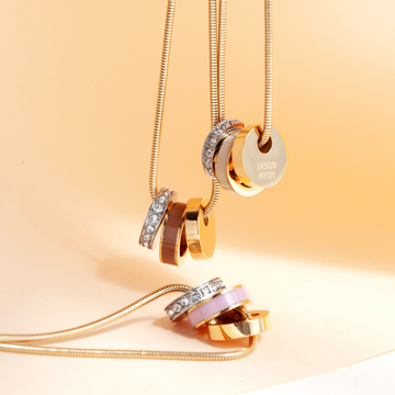 Sustainable gold jewelry assortment with eco-friendly recycled ocean plastic details 