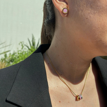 Minimalist gold jewelry made from upcycled marine waste.