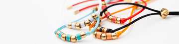 Collection of colorful adjustable cord bracelets 
