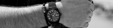 men arm with Jason Hyde watch and Thalassa magnet bracelet in banner