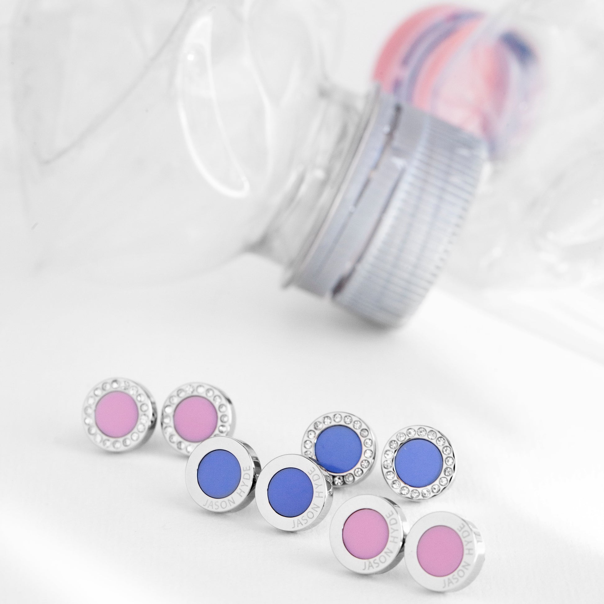 Jason Hyde stud earrings: pink and blue