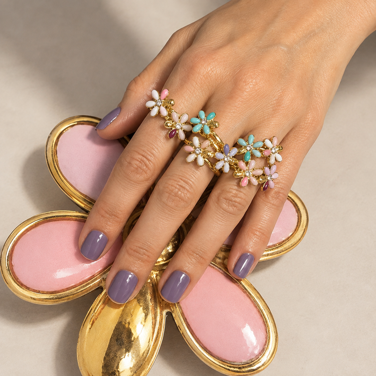 Coral chips floral ring with gold-tone band and pink, blue, and white enamel flowers