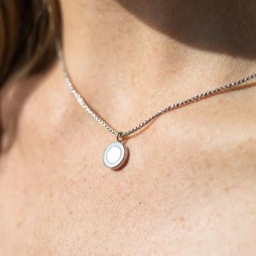 Minimalist silver necklace with white round charm