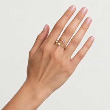 Hand wearing Jason Hyde New Wave gold double ring with white and fondant pink chips