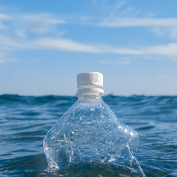 Plastic bottle floating in ocean water