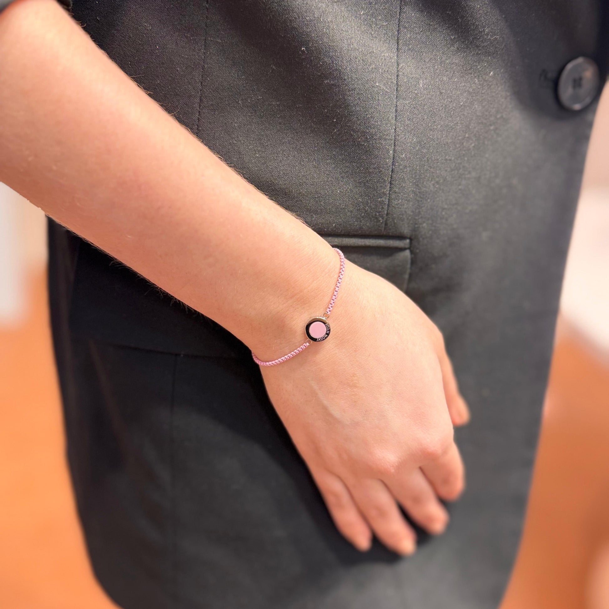 Wrist wearing a delicate Ocean Pink Chip  bracelet 