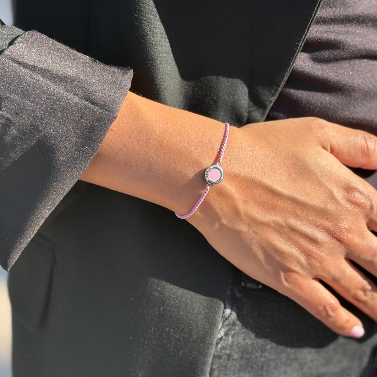 Jason Hyde Fondant pink and silver bracelet on a wrist.