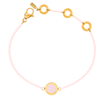 Light pink chain bracelet with a matching circular enamel charm