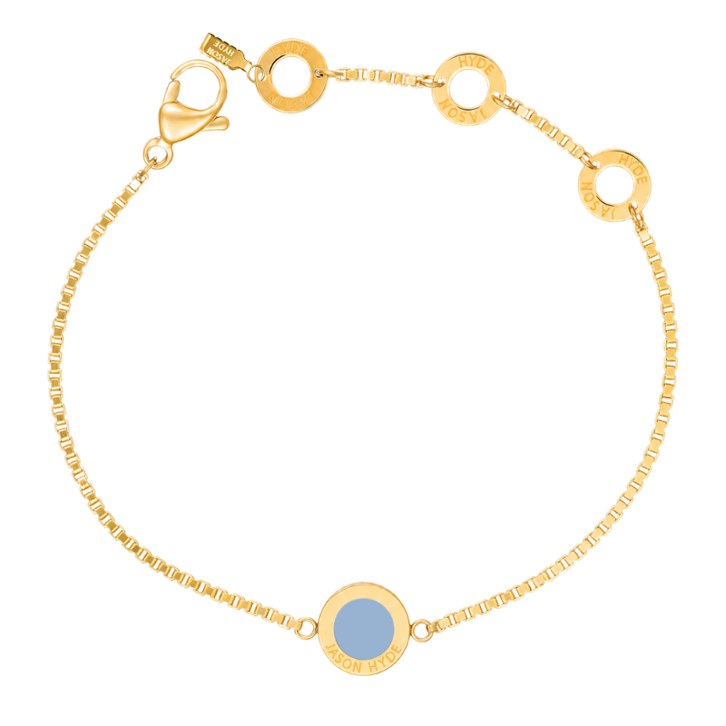 Round powder blue charm gold bracelet from Jason Hyde.