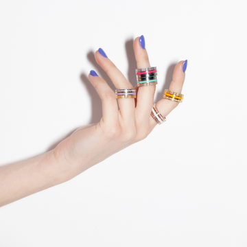 Wewa tube rings in multiple colors on fingers