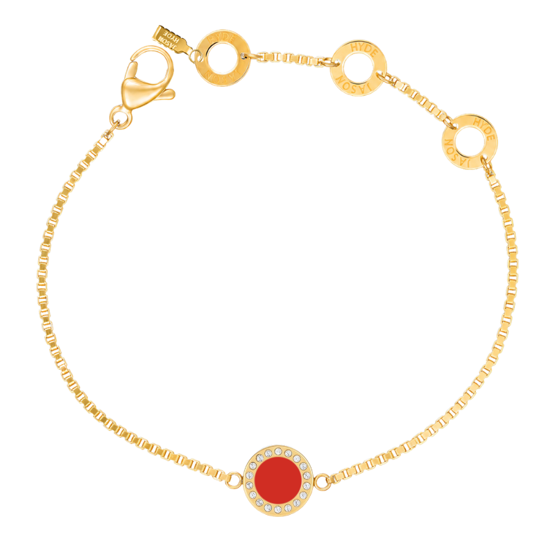 Gold chain bracelet with a red circular charm by Jason Hyde.