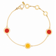 Gold chain bracelet with two red circular charms and one yellow charm.