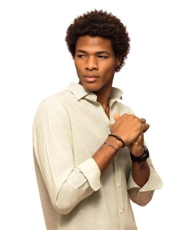 Man in white shirt modeling black Jason Hyde jewelry