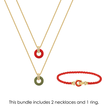Two gold necklaces with red and green recycled ocean plastic charms next to a red woven eco-friendly bracelet.