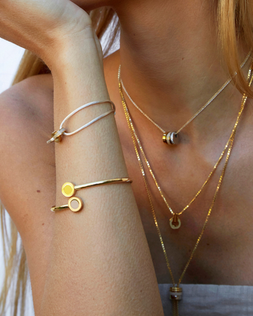 Layered gold pendant necklaces and wrap bracelets for women