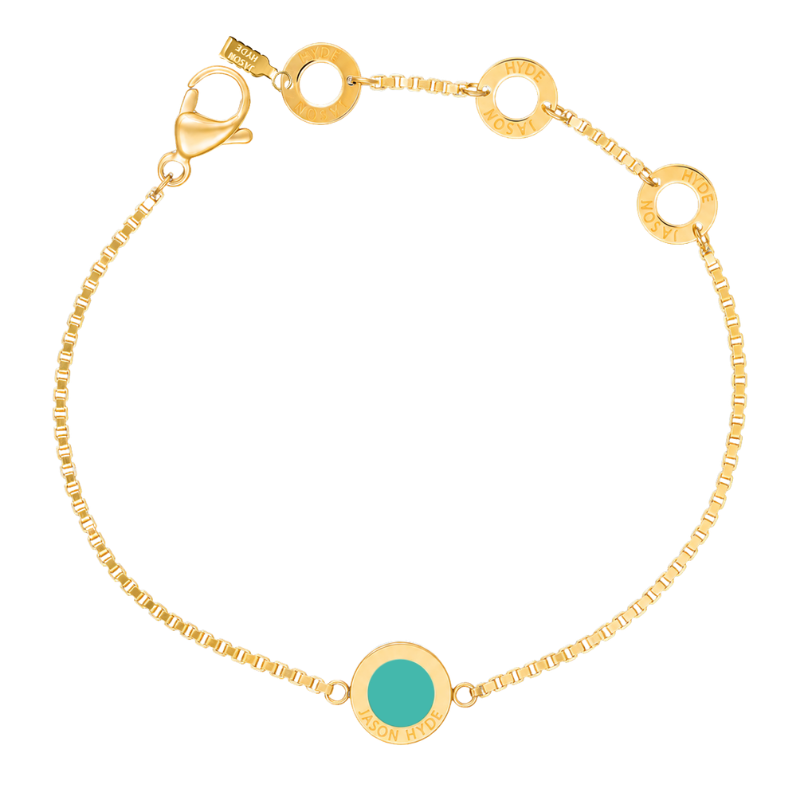 Gold box chain bracelet with turquoise charm detail.